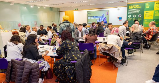 Adults in a classroom participating in a workshop