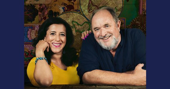 photo of Anita Anand and William Dalrymple smiling at camera