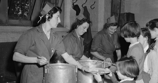 Photograph from 1954 of lunchtime at a school in Oswestry.