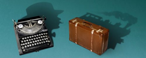 A vintage black typewriter and a brown suitcase sit on a teal background. Their shadows form the silhouette of Hercule Poirot behind the typewriter and a steam train behind the suitcase, creating a visual metaphor for mystery writing and travel.
