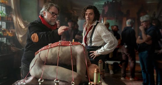 Guillermo del Toro and Oscar Isaac as Victor Frankenstein on the set of Frankenstein.