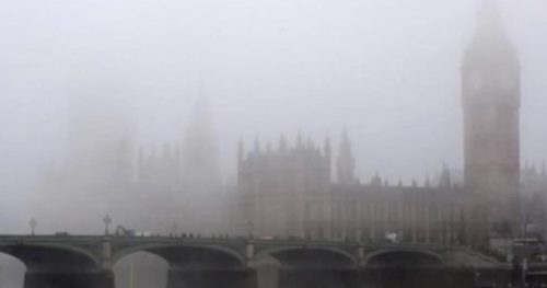 The Houses of Parliament, Big Ben and Westminster Bridge barely visible in the smog.