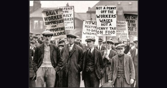 A group of men with placates at a protest march in Gateshead, 1926.