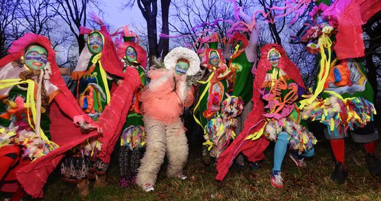 Mermaid Chunky posing in the woods with yellow ribbons
