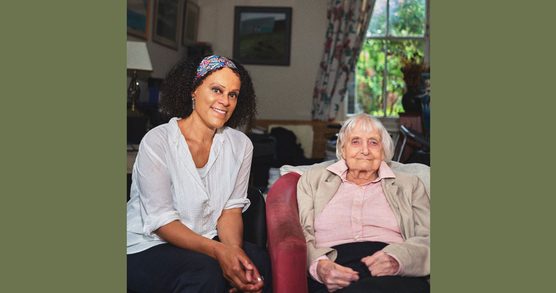Two women seated together, left Bernadine Evaristo in a white shirt, right Maureen Duffy in a pink shirt
