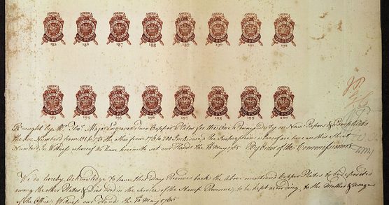 Four lines of red one-penny stamps, with six lines of handwriting underneath.