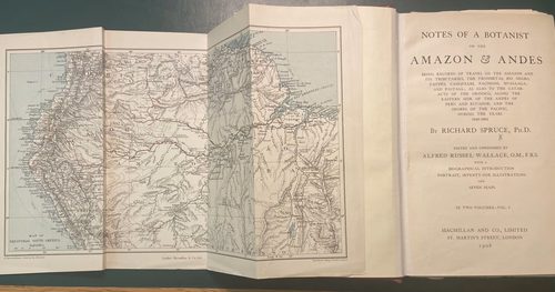 Book open at the title page with a large fold-out map of the Amazon also open.
