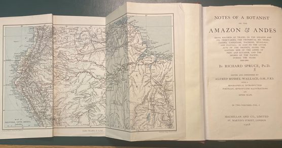 Book open at the title page with a large fold-out map of the Amazon also open.