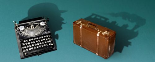 Illustration showing a typewriter and an old fashioned suitcase on a blue green background. The shadow from the typewriter forms a silhouette of a man, the shadow of the case is the shame of a steam train engine