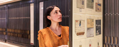 A visitor looking at the Philatelic display