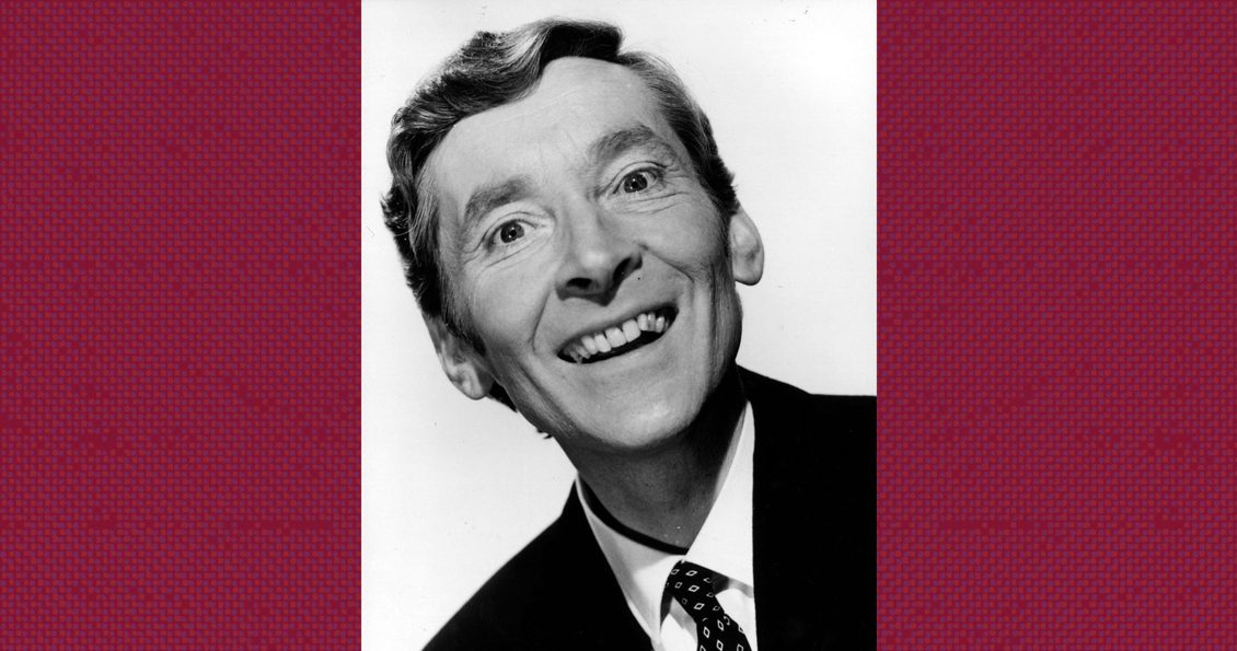 Monochrome photograph of Kenneth Williams smiling