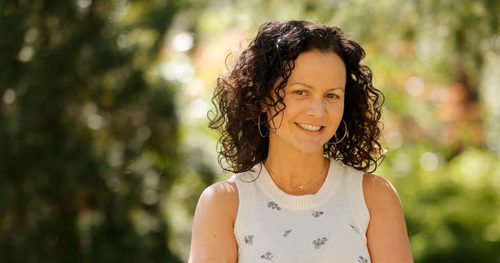 photo of a woman in a white top