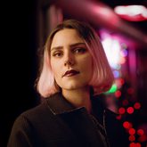 Photo of Yara Rodrigues Fowler, dark jacket, bobbed pink hair.