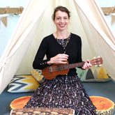 picture of storyteller Vanessa Woolf with a ukelele