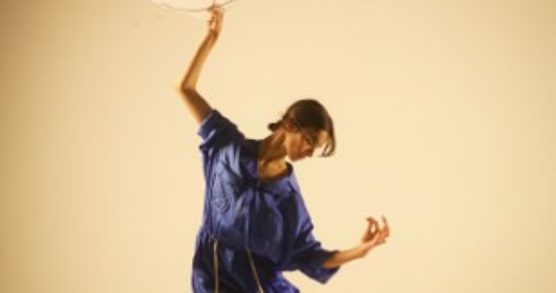 Woman dancing with a fan
