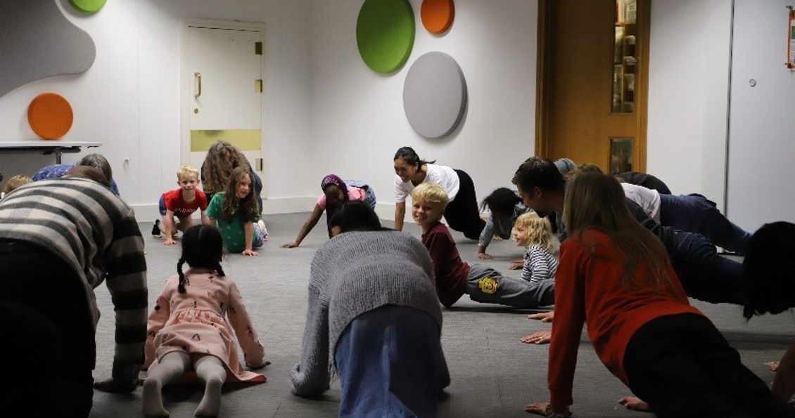 families dancing in the learning centre